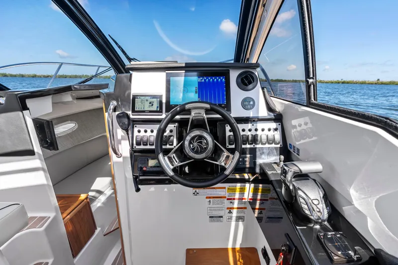 Slide: The Image of Cockpit of 2026 Solara S-250 Coupe with advanced navigation system and steering wheel. - 14