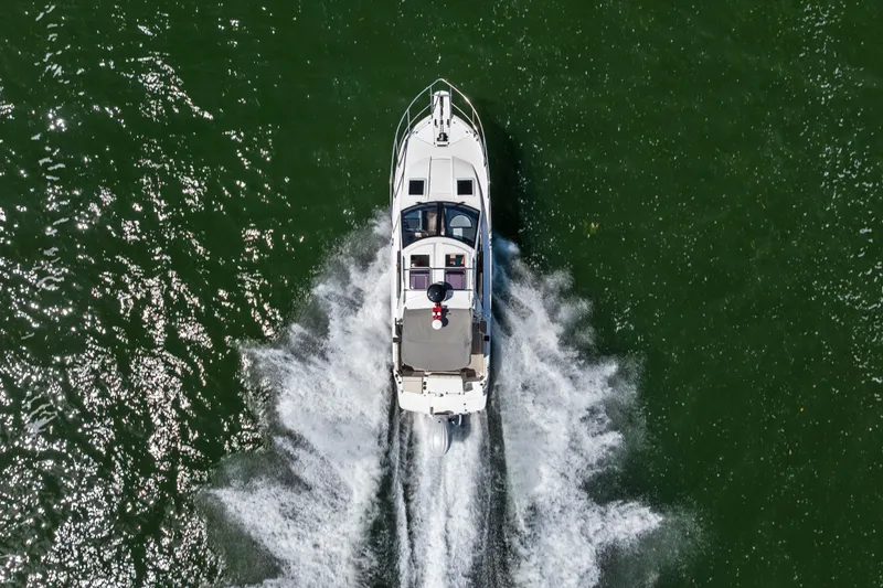 Slide: The Image of Aerial view of 2026 Solara S-250 Coupe cruising on green water. - 4