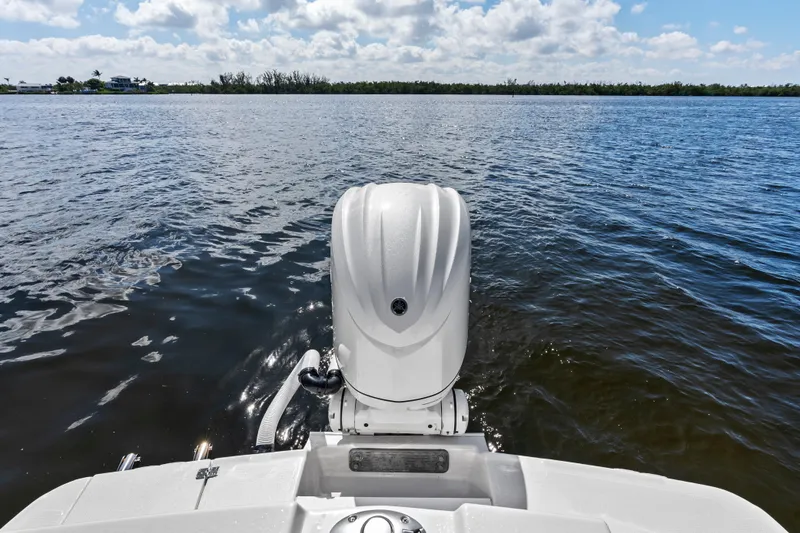 Slide: The Image of 2026 Solara S-250 Coupe boat engine on calm water under a cloudy sky. - 6