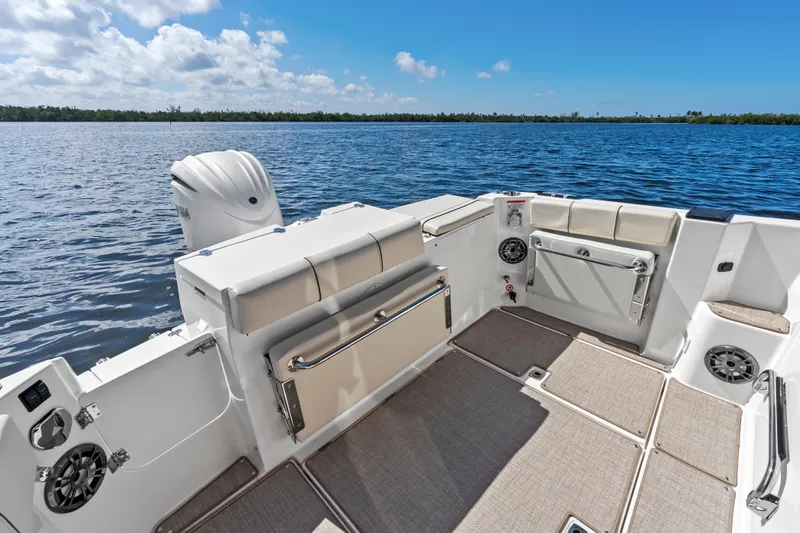 Slide: The Image of 2026 Solara S-250 Coupe boat interior with seating, speakers, and scenic water view. - 7