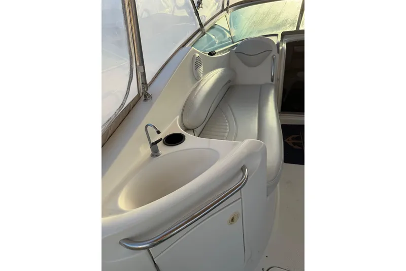 Slide: The Image of 2001 Maxum 2800 SCR boat interior with sink and seating area. - 5