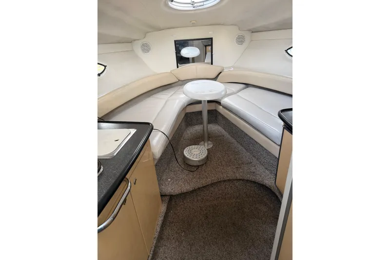 Slide: The Image of Interior of 2001 Maxum 2800 SCR boat with cozy seating and compact table. - 6