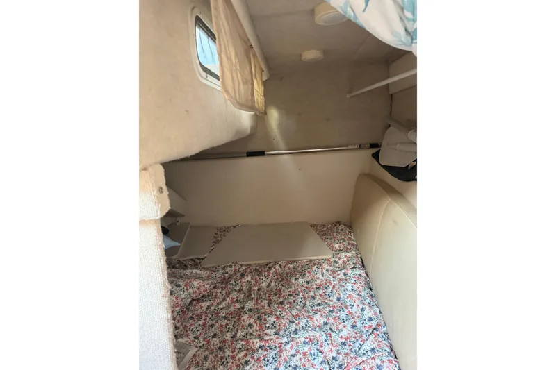 Slide: The Image of Interior cabin of 2001 Maxum 2800 SCR boat with floral bedding. - 9