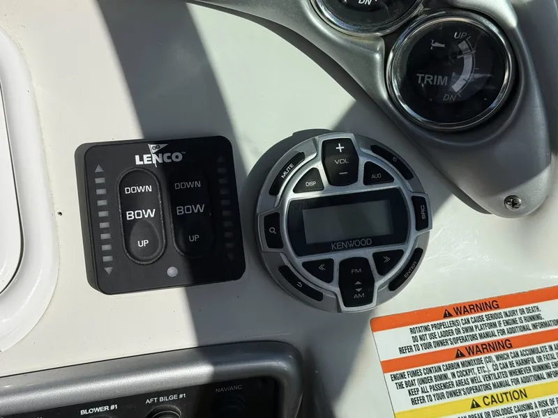 Slide: The Image of 2007 Crownline Bowrider 320 LS dashboard with Lenco and Kenwood controls. - 10