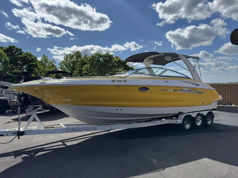 Slide: The Image of Yellow 2007 Crownline Bowrider 320 LS boat on trailer. - 11