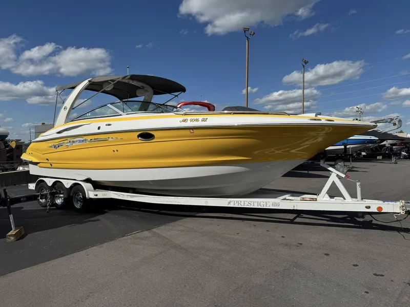 Slide: The Image of Yellow 2007 Crownline Bowrider 320 LS boat on trailer. - 13