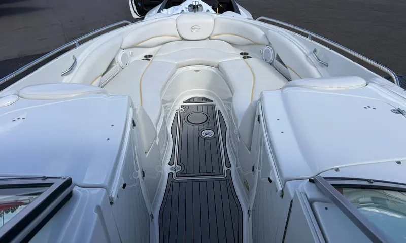 Slide: The Image of Interior of a 2007 Crownline Bowrider 320 LS with white seating. - 14
