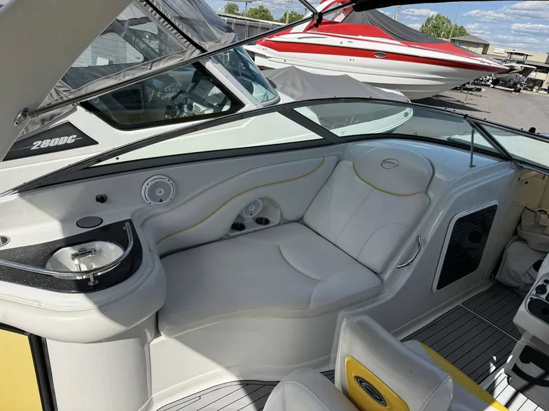 Slide: The Image of Interior of a 2007 Crownline Bowrider 320 LS with white seating. - 17