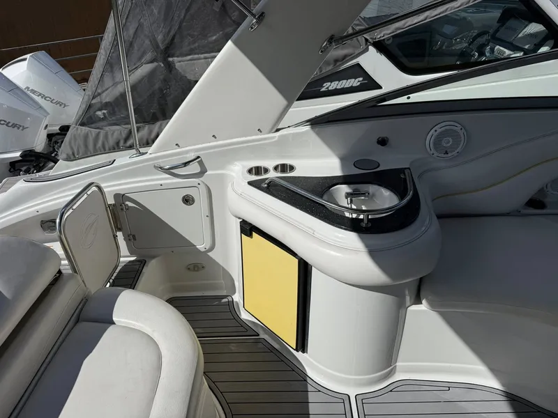 Slide: The Image of Interior of 2007 Crownline Bowrider 320 LS with sink and seating area. - 18