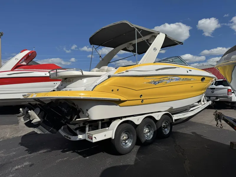 Slide: The Image of 2007 Crownline Bowrider 320 LS boat on trailer, yellow and white. - 19