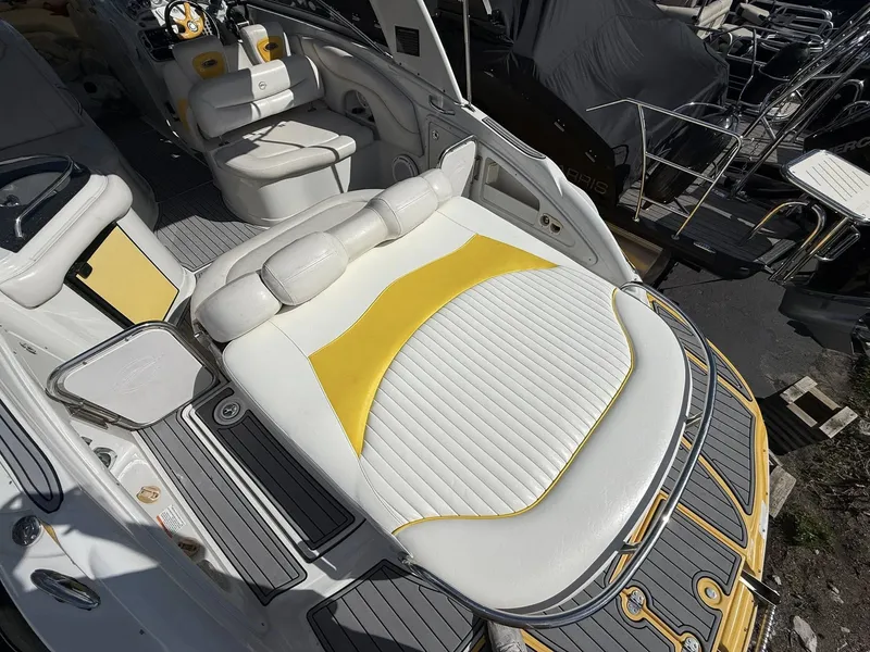 Slide: The Image of Interior of a 2007 Crownline Bowrider 320 LS with yellow accents. - 23