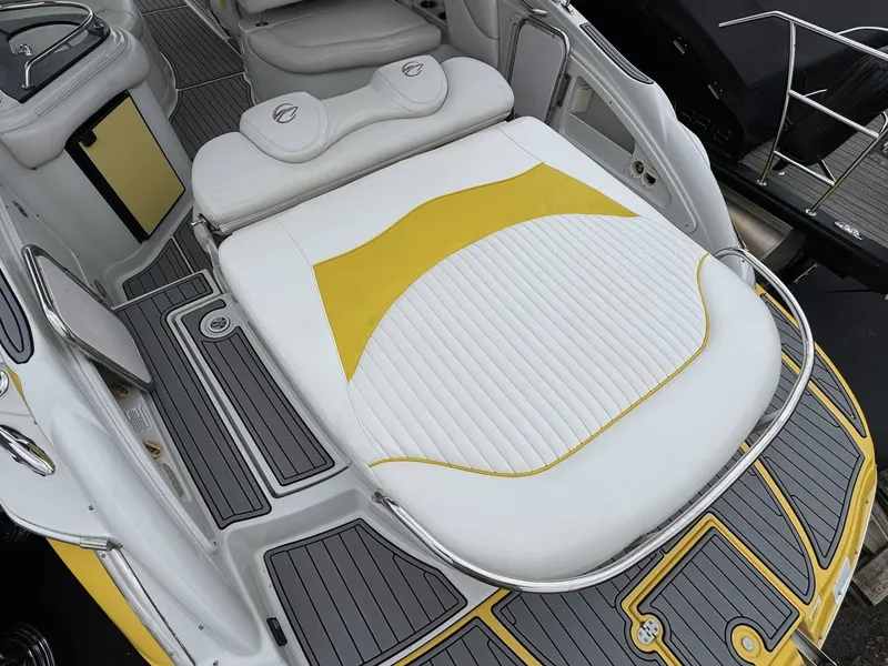 Slide: The Image of 2007 Crownline Bowrider 320 LS with yellow accents and sunbathing area. - 4
