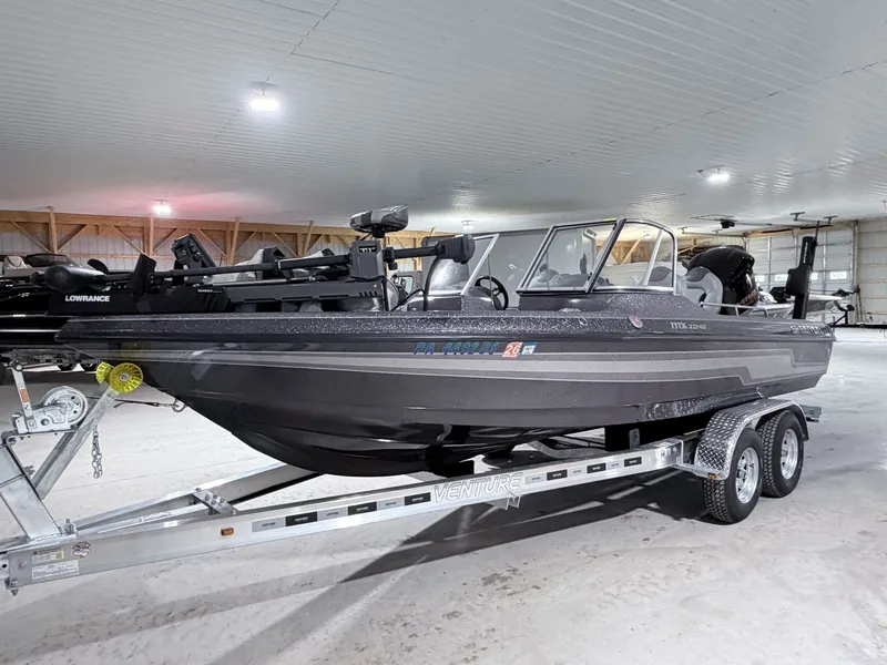 Slide: The Image of 2016 Skeeter MX 2040 boat on trailer in warehouse. - 10