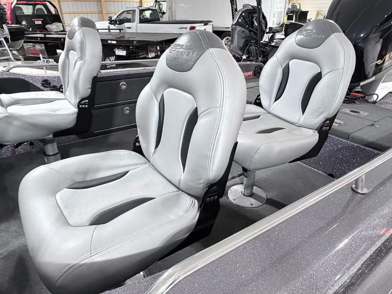 Slide: The Image of Interior of a 2016 Skeeter MX 2040 with gray seats. - 13