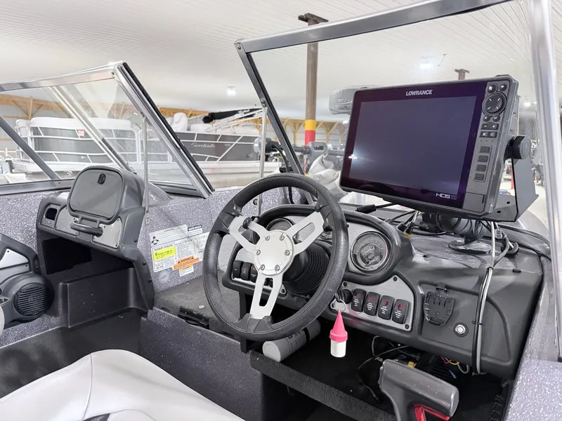 Slide: The Image of Interior of a 2016 Skeeter MX 2040 boat with Lowrance display. - 16