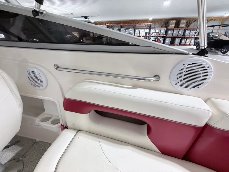 Slide: The Image of Interior of a 2003 Rinker 232 Captiva boat with speakers. - 12