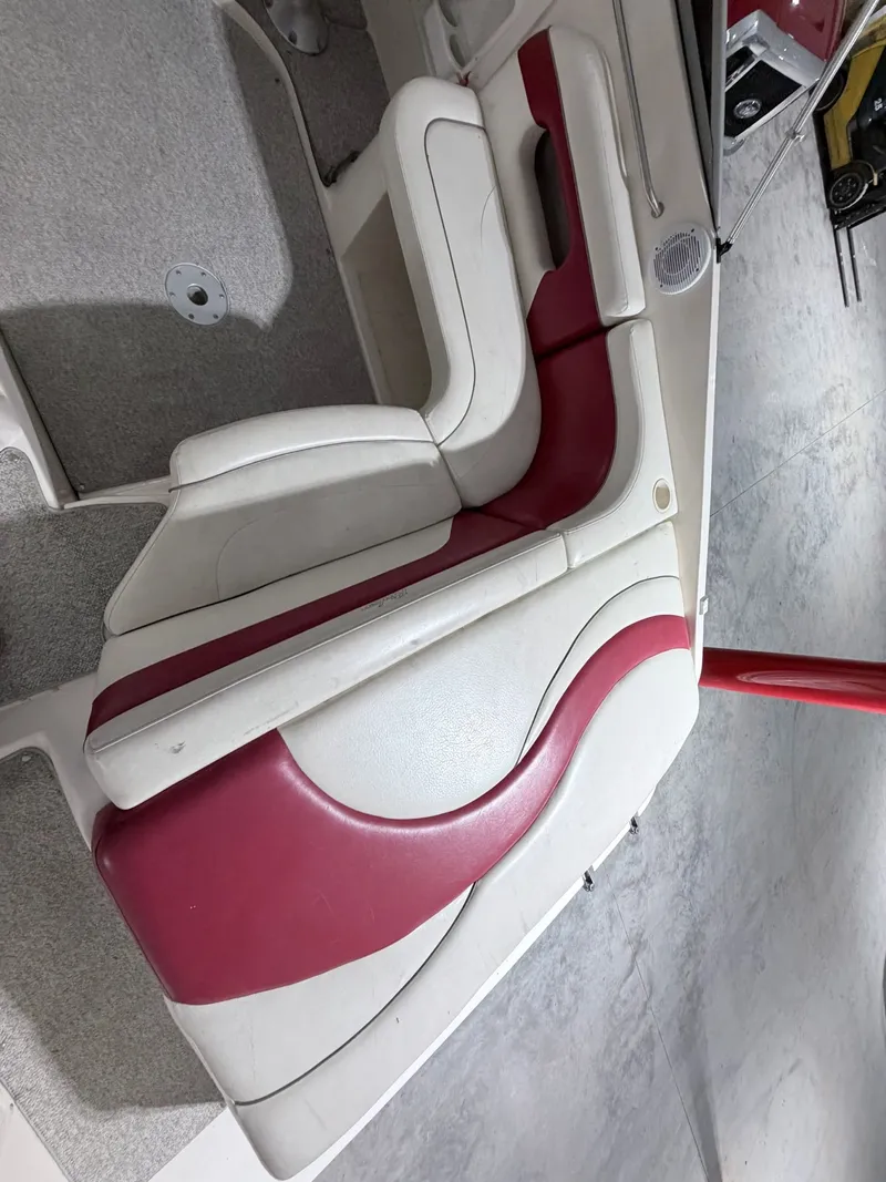 Slide: The Image of Rinker 232 Captiva 2003 boat seat with red and white upholstery. - 16