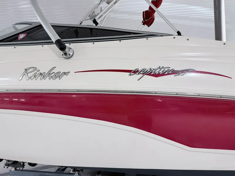 Slide: The Image of 2003 Rinker 232 Captiva boat with red and white design. - 18