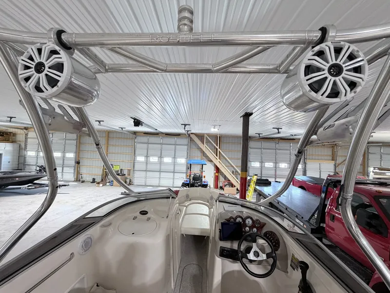 Slide: The Image of Interior view of a 2003 Rinker 232 Captiva boat with speakers. - 26