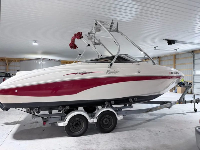 Slide: The Image of 2003 Rinker 232 Captiva boat on trailer in storage facility. - 6
