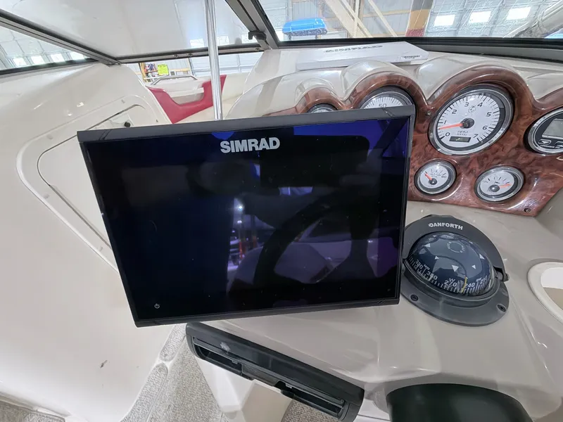 Slide: The Image of Dashboard of a 2003 Rinker 232 Captiva with Simrad screen. - 7