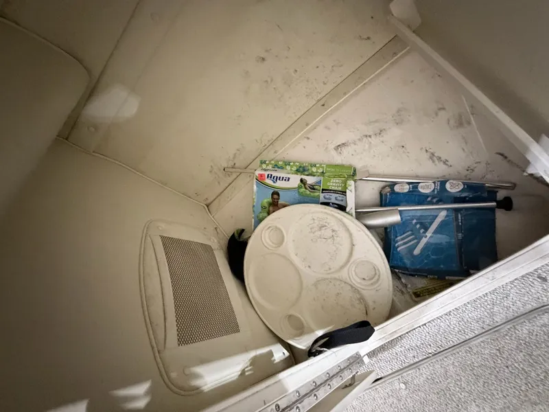 Slide: The Image of Storage compartment in Rinker 232 Captiva boat with accessories, 2003 model. - 8