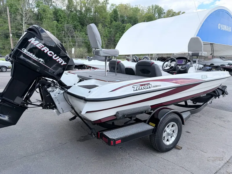 Slide: The Image of 2008 Triton 18X2 boat with Mercury engine on trailer. - 11