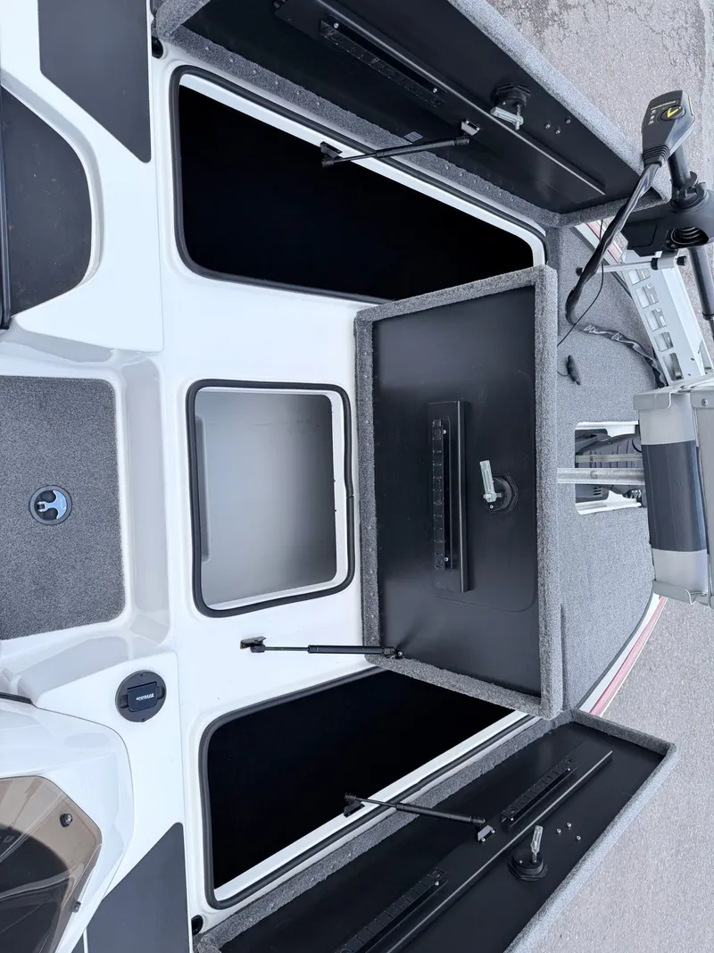 Slide: The Image of 2008 Triton 18X2 boat with open storage compartments. - 15