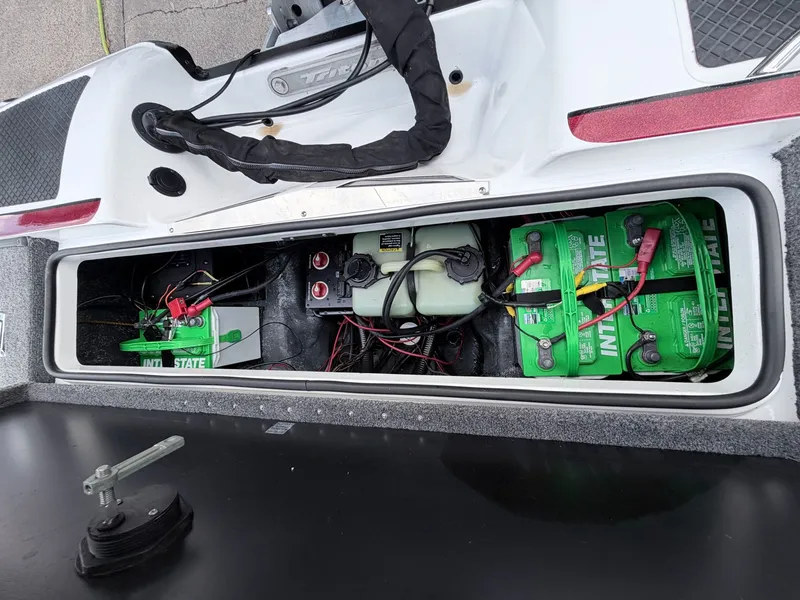 Slide: The Image of Battery compartment of a 2008 Triton 18X2 boat with Interstate batteries. - 18
