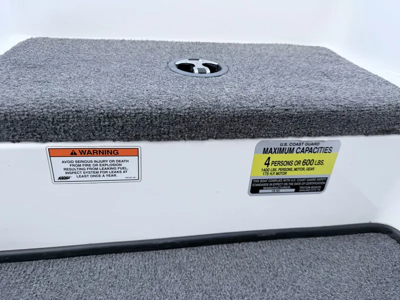 Slide: The Image of 2008 Triton 18X2 boat with warning and capacity labels. - 19
