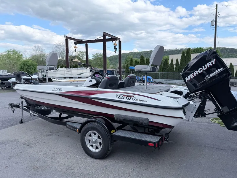 Slide: The Image of 2008 Triton 18X2 boat with Mercury engine on trailer. - 21