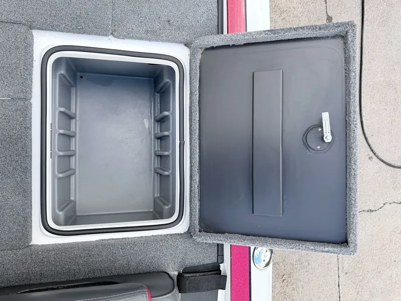 Slide: The Image of Open storage compartment of a 2008 Triton 18X2 boat. - 27