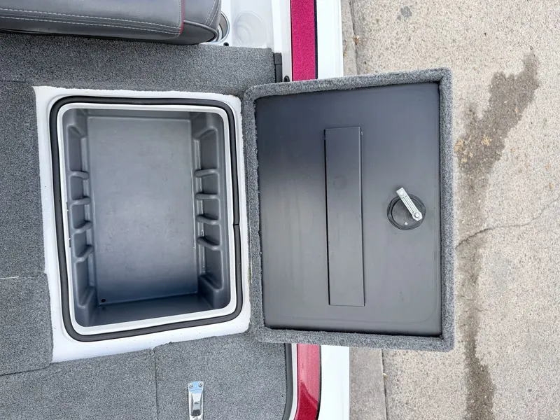 Slide: The Image of Open storage compartment in 2008 Triton 18X2 boat. - 28