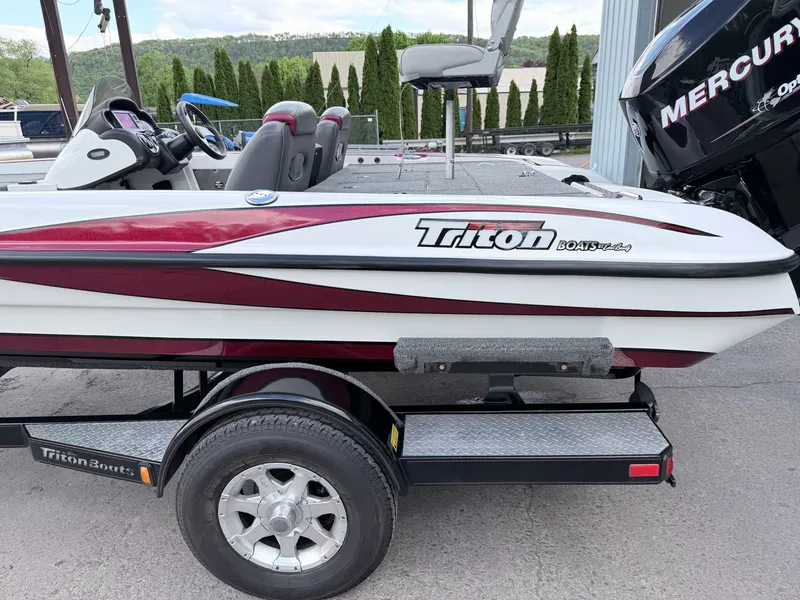 Slide: The Image of 2008 Triton 18X2 boat with trailer and Mercury engine. - 29