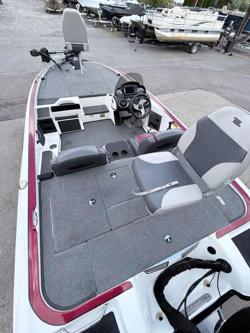 Slide: The Image of Interior view of a 2008 Triton 18X2 boat with gray seats. - 30