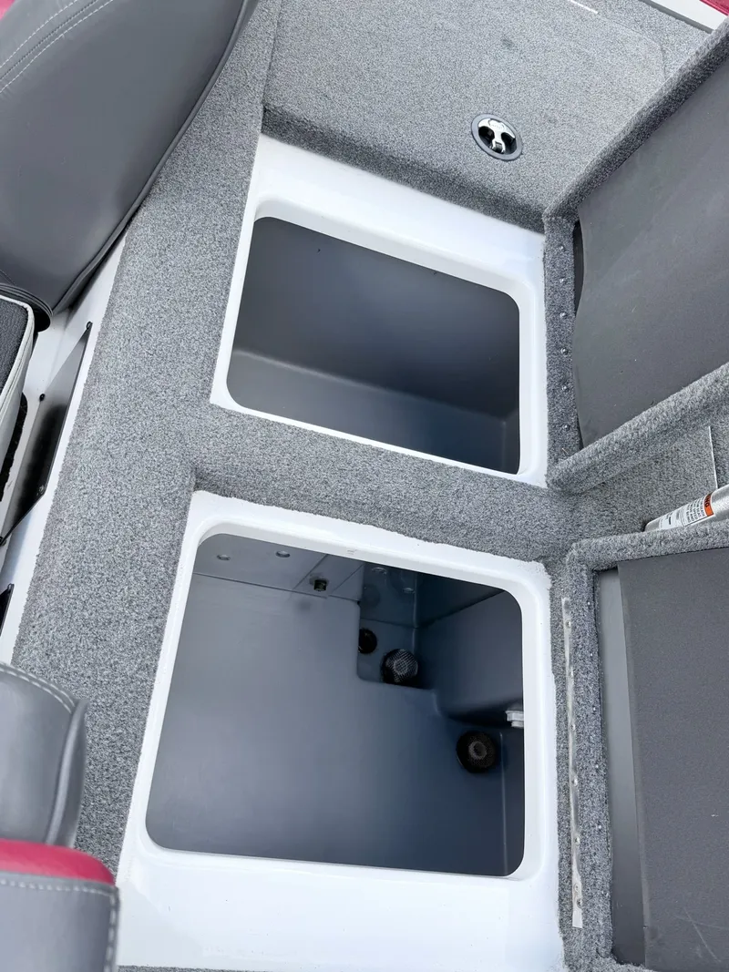 Slide: The Image of Interior of a 2008 Triton 18X2 boat with storage compartments. - 4