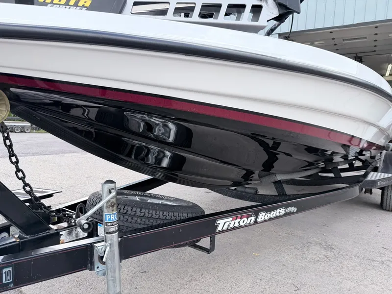 Slide: The Image of 2008 Triton 18X2 boat on trailer, close-up of hull. - 5