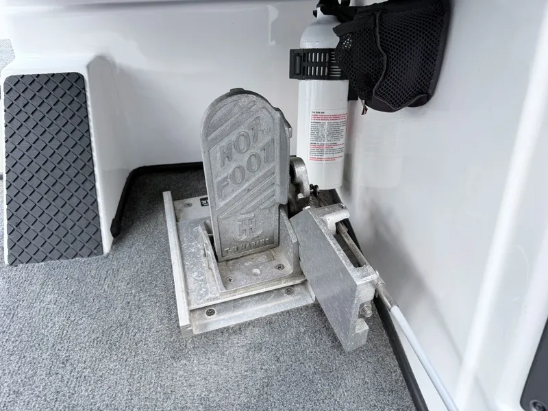 Slide: The Image of Triton 18X2 2008 boat pedal and fire extinguisher. - 6