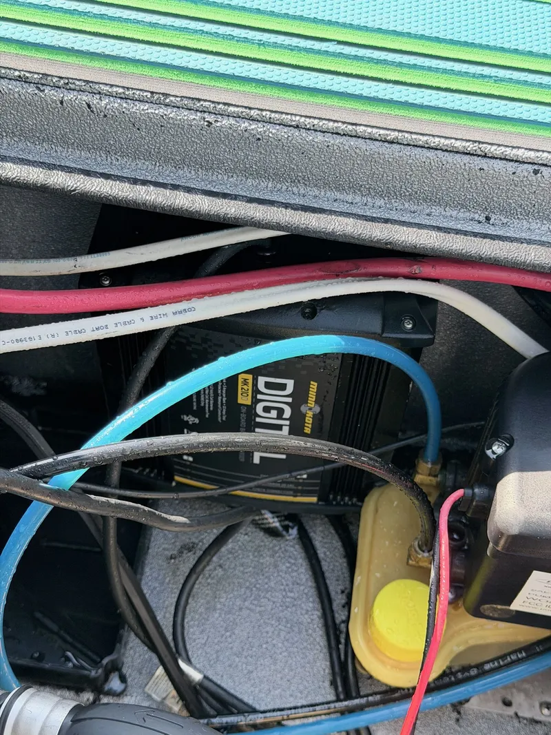 Slide: The Image of Interior view of Xpress X19 boat, showing wiring and electronics. - 24