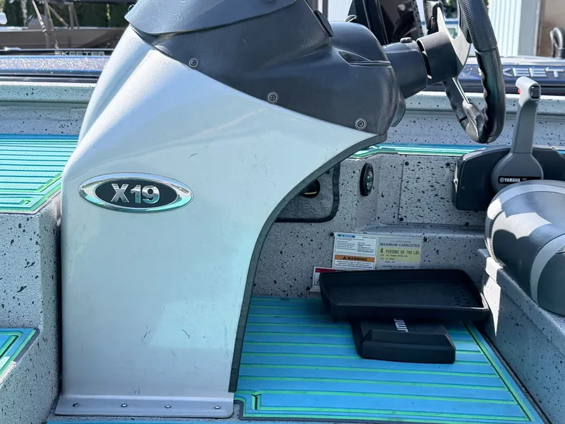 Slide: The Image of Interior view of a 2017 Xpress X19 boat with steering console. - 27