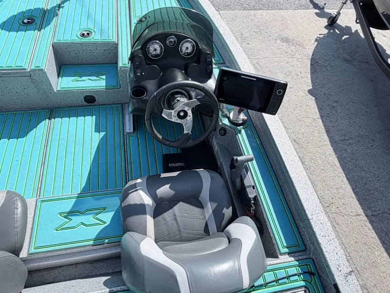 Slide: The Image of Interior of a 2017 Xpress X19 boat with steering console. - 32