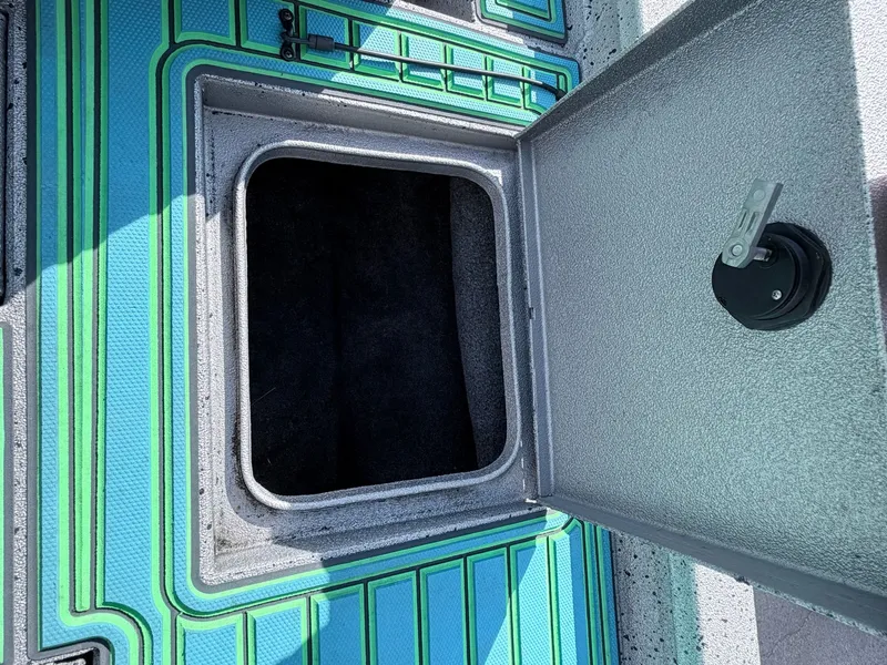 Slide: The Image of Open storage compartment on a 2017 Xpress X19 boat. - 35