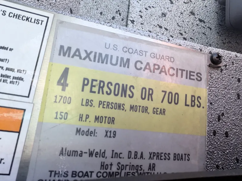 Slide: The Image of US Coast Guard capacity label on Xpress X19 boat, 2017. - 5