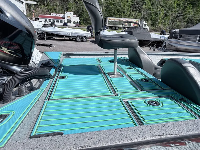 Slide: The Image of 2017 Xpress X19 boat with turquoise deck and seating. - 7
