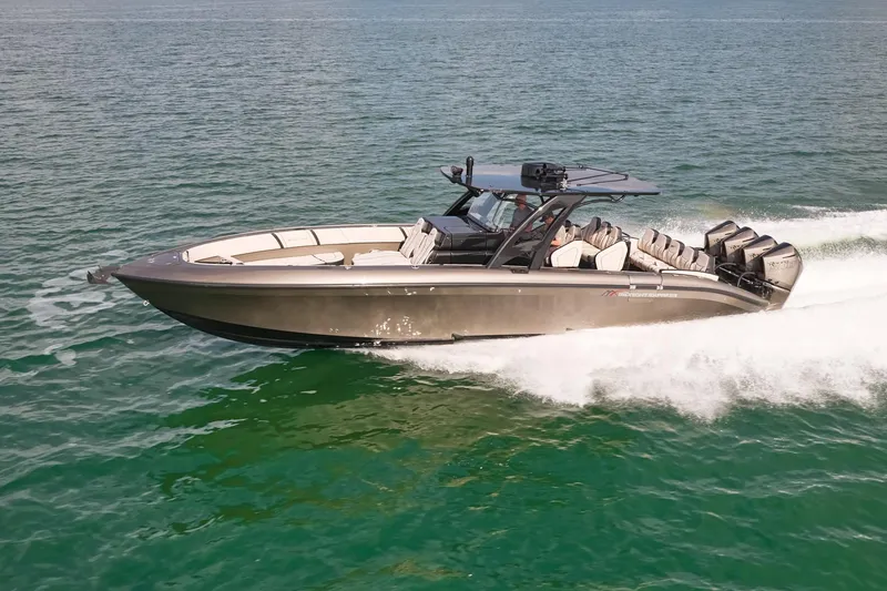 The Image of 2025 Midnight Express 37 Open boat cruising on clear blue water. - 0