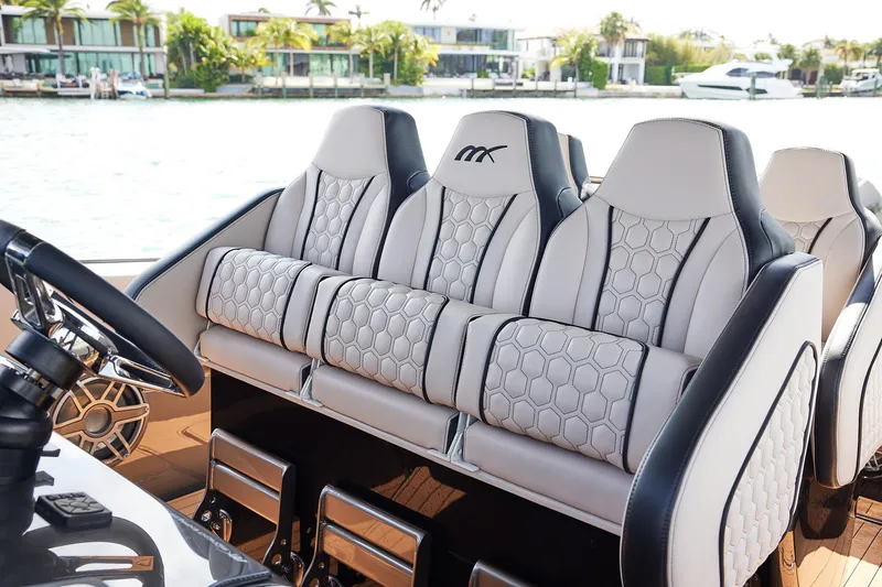 Slide: The Image of Luxurious seating on the 2025 Midnight Express 37 Open boat, featuring elegant design and waterfront view. - 14
