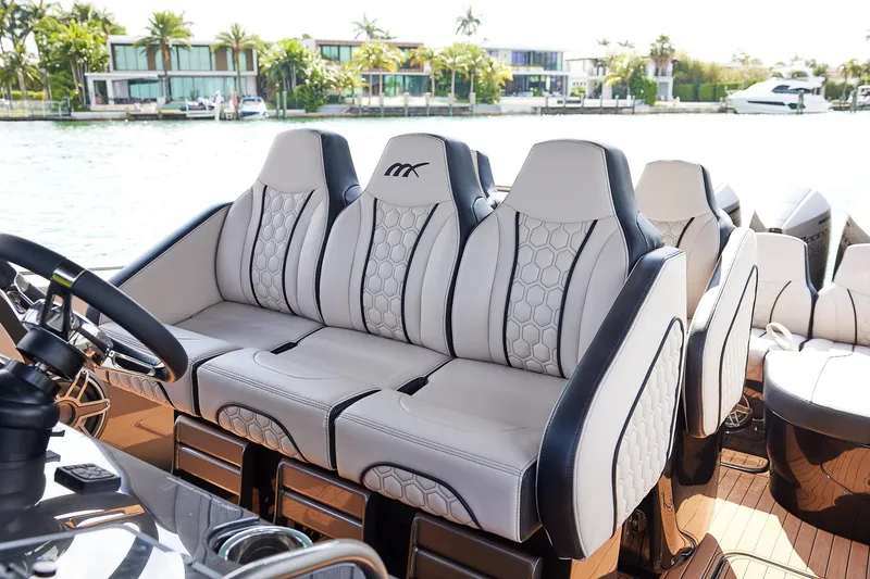 Slide: The Image of Luxurious seating on 2025 Midnight Express 37 Open boat, featuring elegant design and waterfront view. - 15