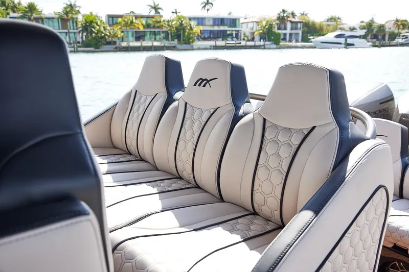 Slide: The Image of Luxurious seating on 2025 Midnight Express 37 Open boat, featuring modern design and waterfront view. - 16