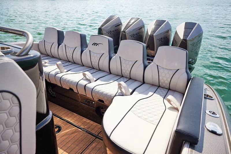 Slide: The Image of Luxury seating on 2025 Midnight Express 37 Open boat with powerful engines. - 19