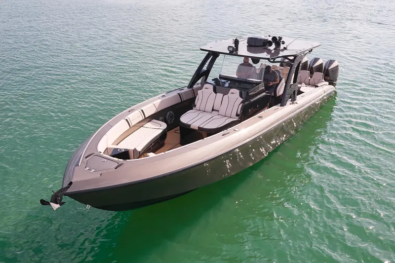 Slide: The Image of 2025 Midnight Express 37 Open boat on clear water, showcasing sleek design and luxury seating. - 4